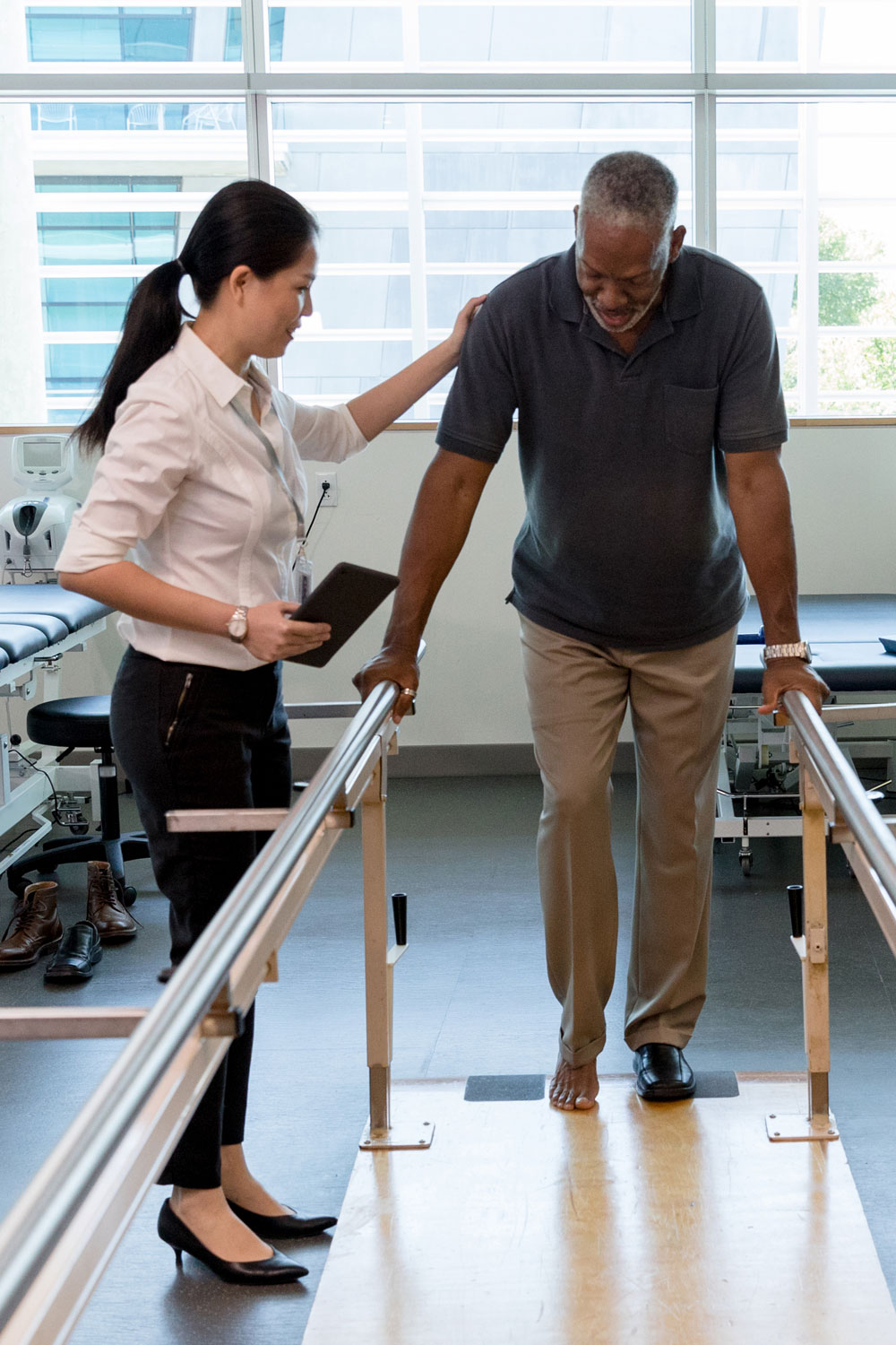 Physical therapist working with senior man